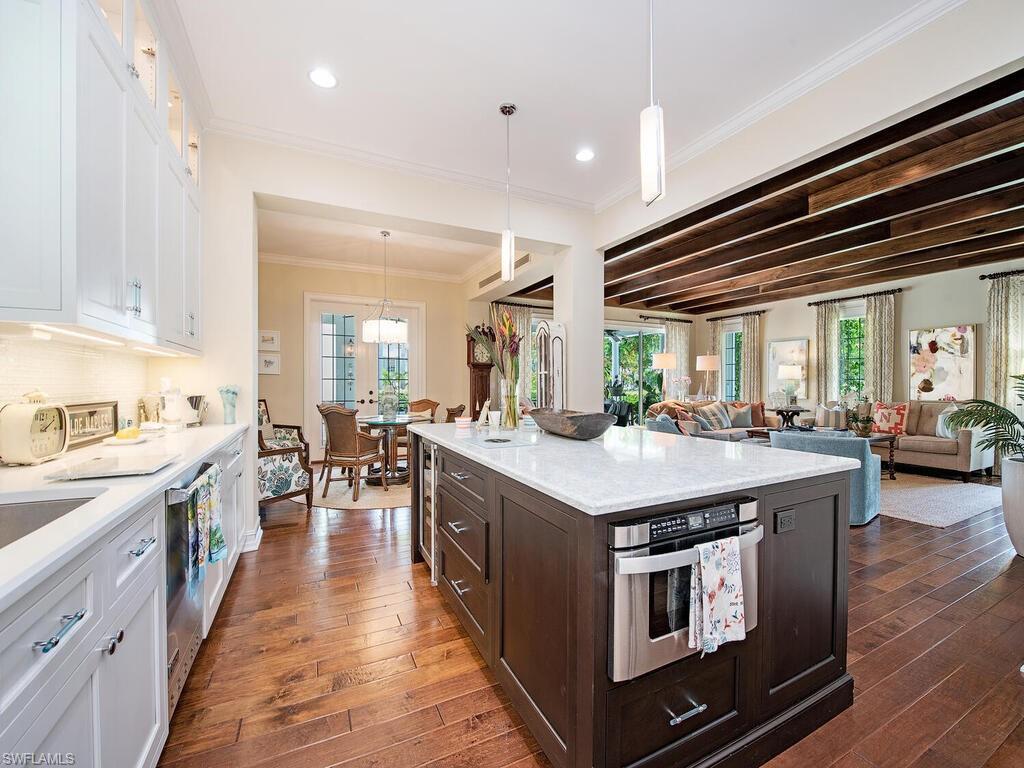 613 14th Avenue South Naples, FL 34102 - Photo 11 of 28 a kitchen with stainless steel appliances granite countertop lots of counter top space