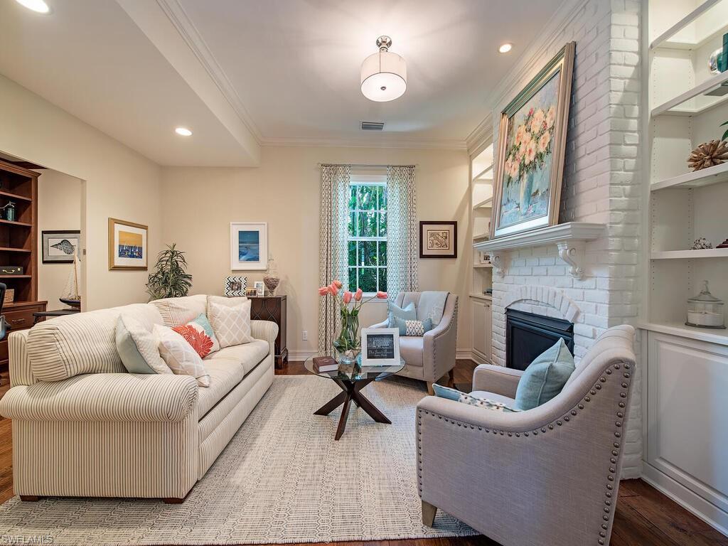 613 14th Avenue South Naples, FL 34102 - Photo 14 of 28 a living room with furniture fireplace and a table