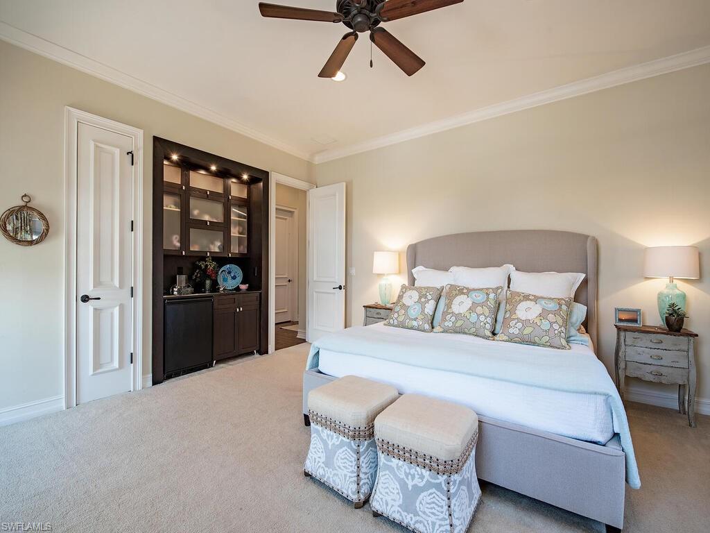 613 14th Avenue South Naples, FL 34102 - Photo 18 of 28 a bedroom with a bed and closet