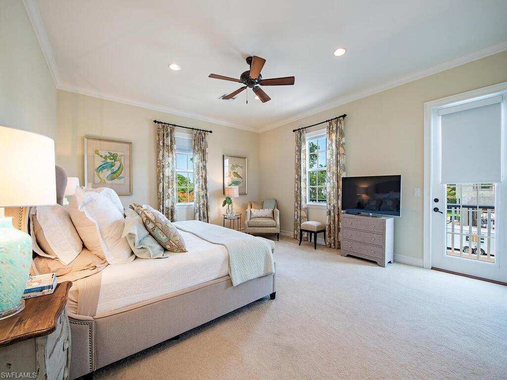 613 14th Avenue South Naples, FL 34102 - Photo 19 of 28 a bedroom with bed tv and window