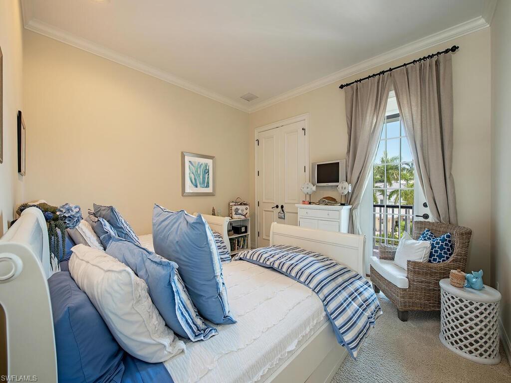 613 14th Avenue South Naples, FL 34102 - Photo 23 of 28 a living room with furniture and a large window