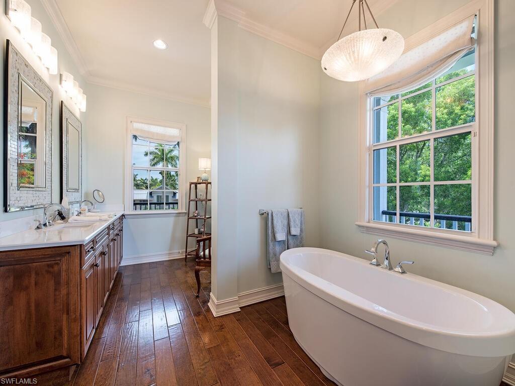 613 14th Avenue South Naples, FL 34102 - Photo 27 of 28 a spacious bathroom with sink and bathtub
