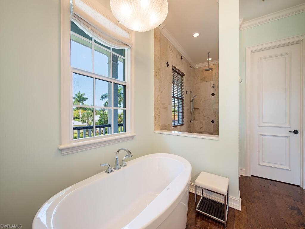 613 14th Avenue South Naples, FL 34102 - Photo 28 of 28 a bathroom with a sink and a mirror
