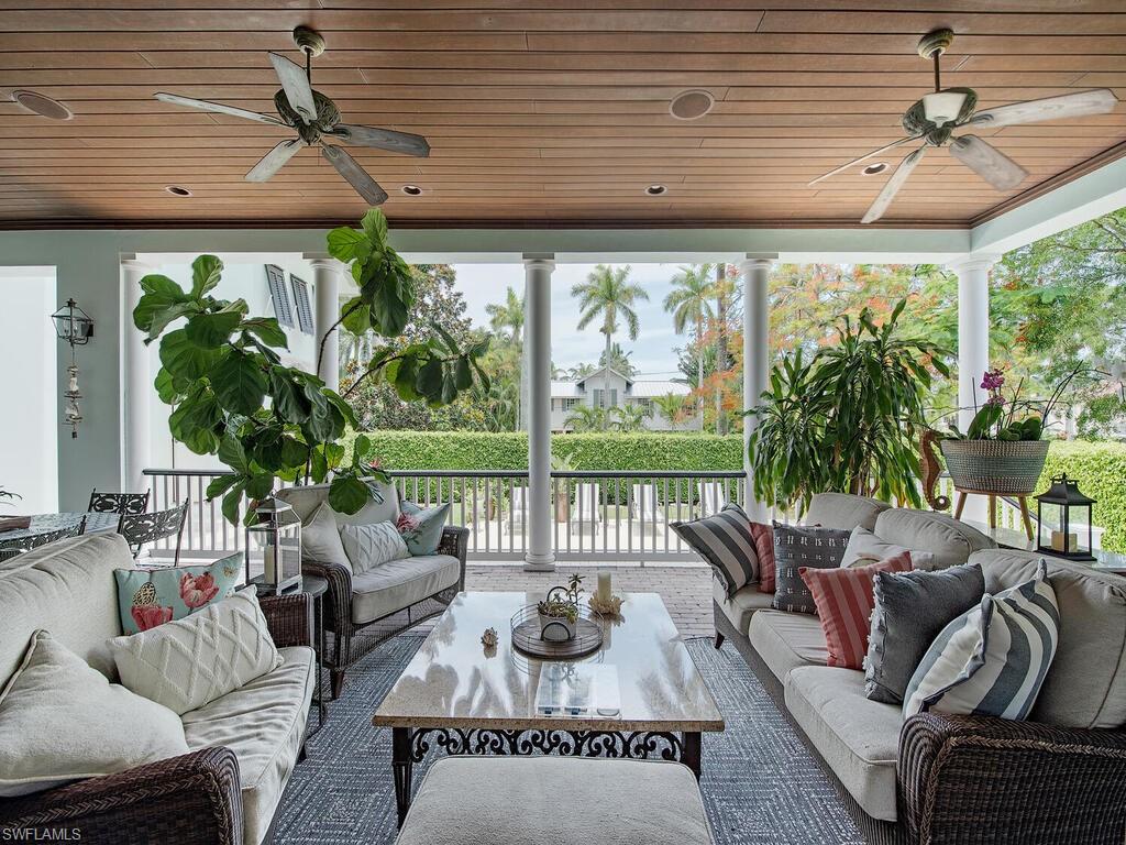 613 14th Avenue South Naples, FL 34102 - Photo 5 of 28 a living room with patio furniture and a potted plant