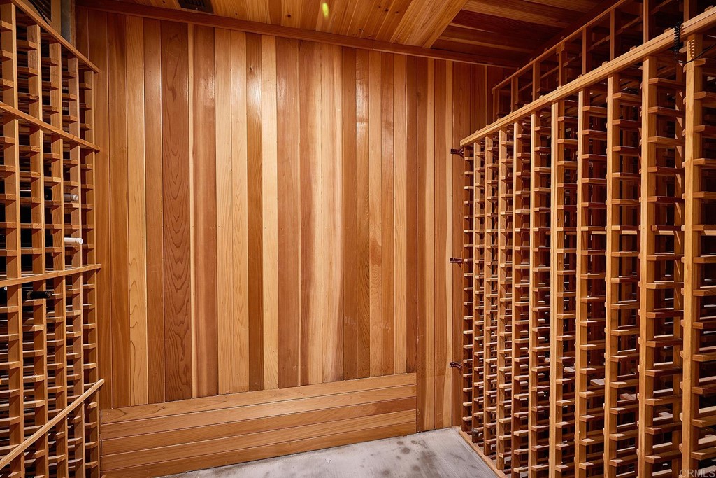 17356 Circa Oriente Rancho Santa Fe, CA 92067 - Photo 12 of 29 a view of a black door and wooden floor