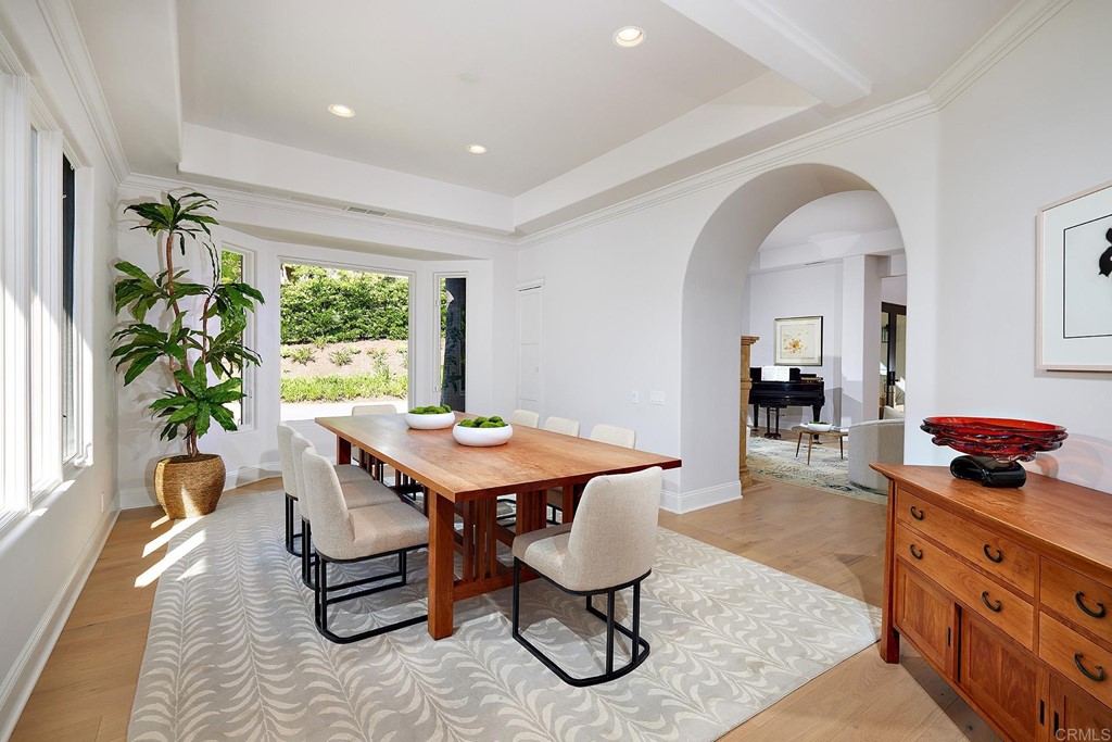 17356 Circa Oriente Rancho Santa Fe, CA 92067 - Photo 15 of 29 a view of a dining room with furniture window and wooden floor