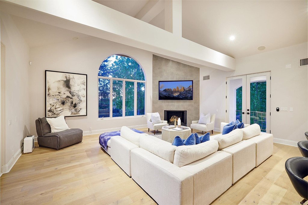 17356 Circa Oriente Rancho Santa Fe, CA 92067 - Photo 4 of 29 a living room with furniture fireplace and a large window
