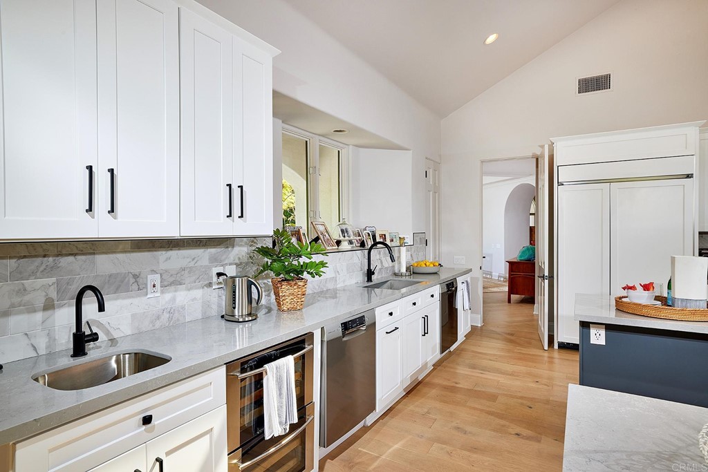 17356 Circa Oriente Rancho Santa Fe, CA 92067 - Photo 7 of 29 a kitchen with sink and cabinets