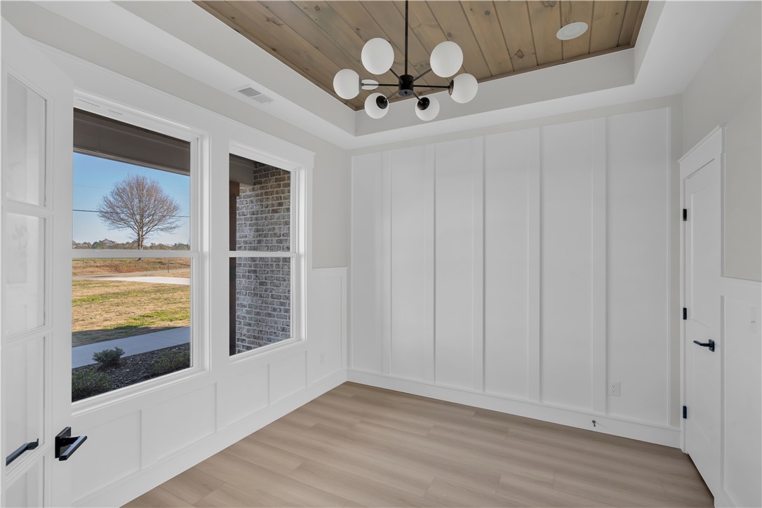 516 Lakeside Drive Anderson, SC 29621 - Photo 9 of 32 Board and batten accents meet warm wood ceilings for a striking, modern aesthetic.