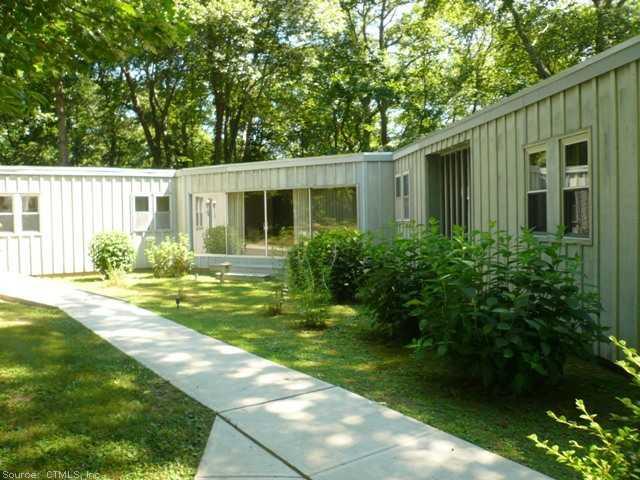 50 Vineyard Point Road Guilford, CT 06437 - Photo 1 of 1 a front view of a house with garden
