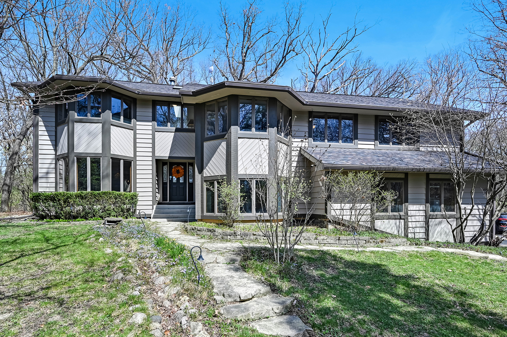 17252 Bluff Road Lemont, IL 60439 - Photo 1 of 1 a front view of a building with a garden