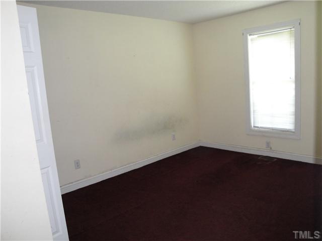 9921 Old Middlesex Road Middlesex, NC 27557 - Photo 8 of 11 an empty room with a window
