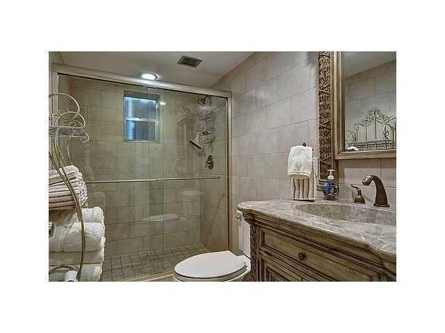2871 North Ocean Boulevard, Unit V345 Boca Raton, FL 33431 - Photo 6 of 13 a bathroom with a sink toilet and shower
