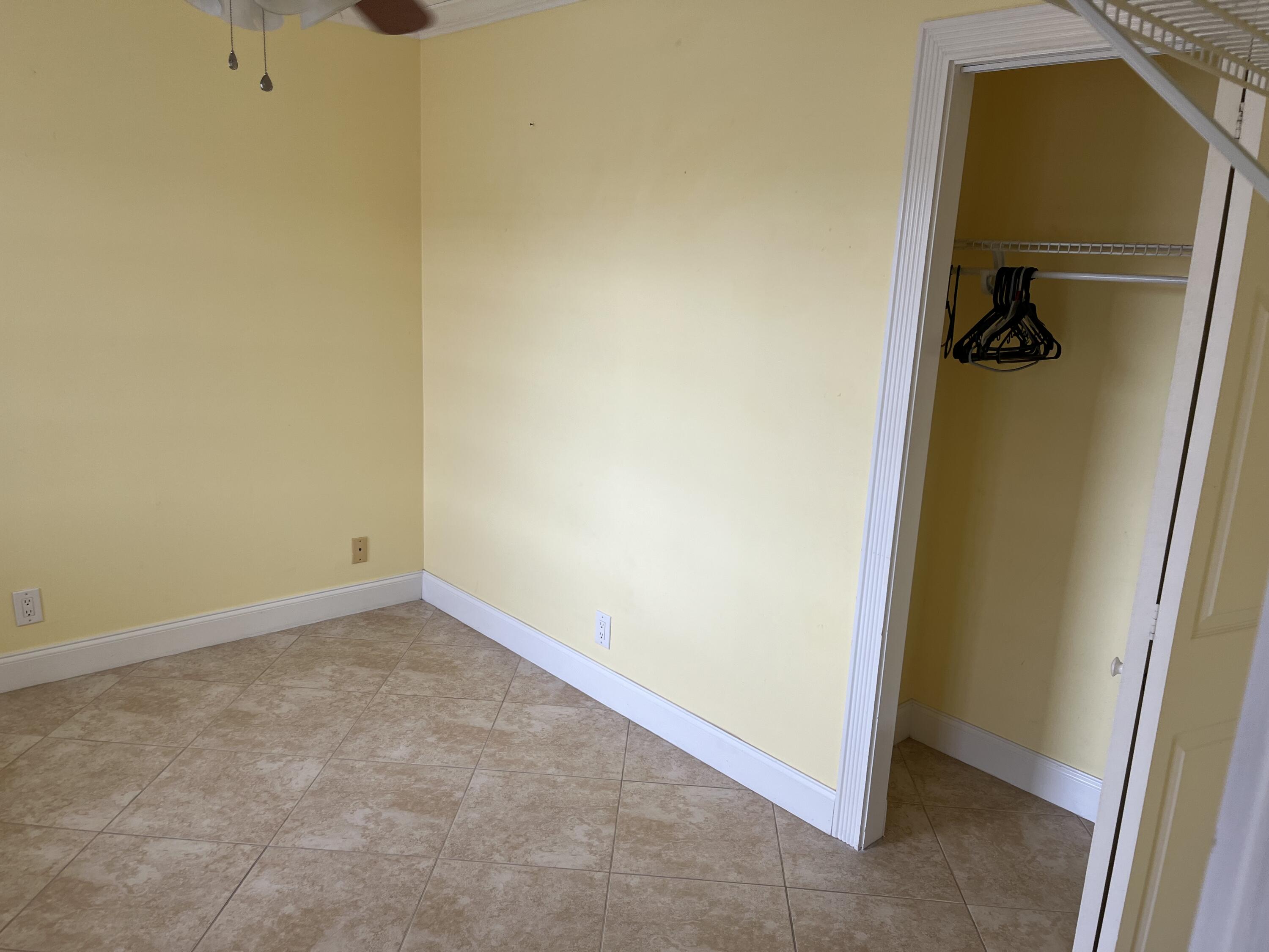 2871 North Ocean Boulevard, Unit V345 Boca Raton, FL 33431 - Photo 9 of 13 an empty room with a door