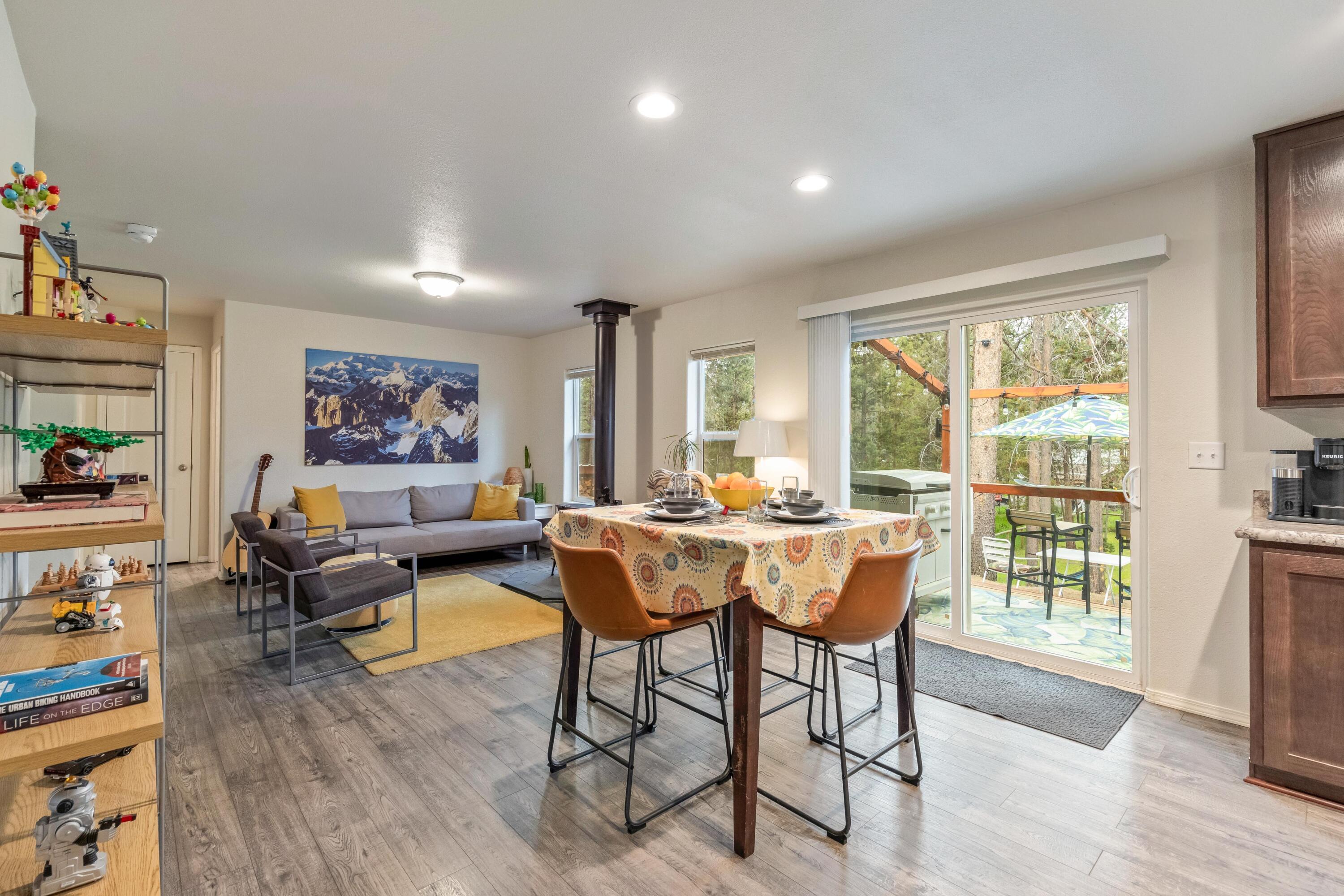 55823 Snow Goose Road Bend, OR 97707 - Photo 10 of 36 a living room with furniture and a large window