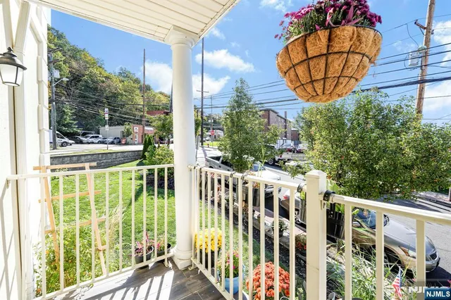 a view of a chairs and table in the balcony