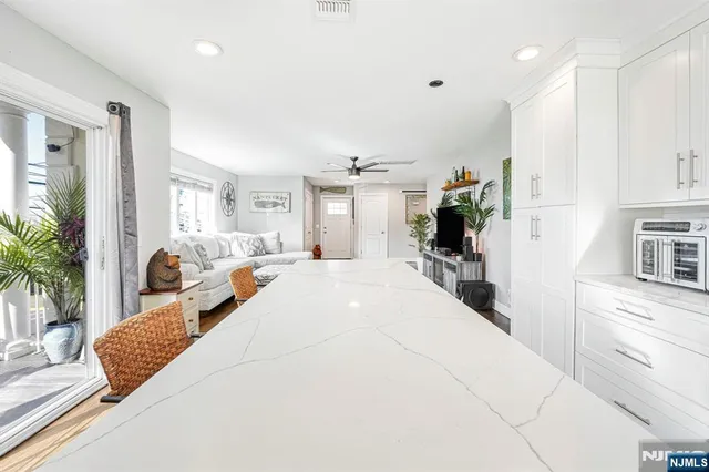 a large white bed in a white room