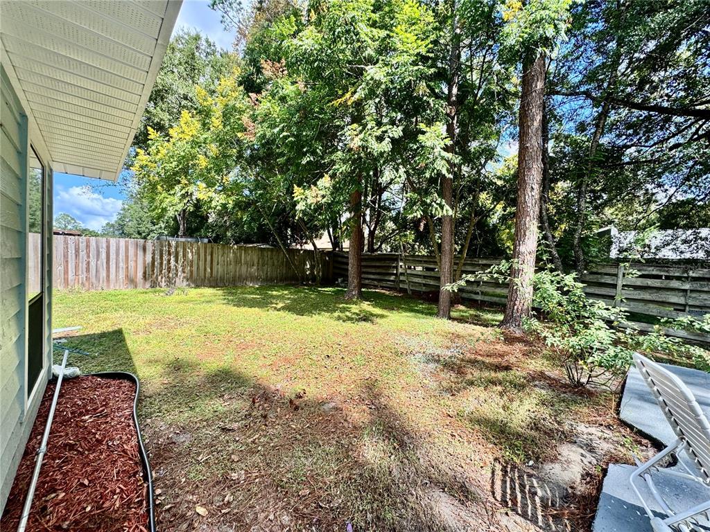 5407 Southwest 82 Terrace Gainesville, FL 32608 - Photo 25 of 31 a view of yard with deck