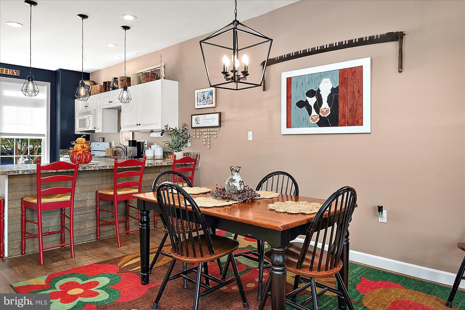 10050 Golf Course Road, Unit 6 Ocean City, MD 21842 - Photo 15 of 60 Charming dining area with vibrant decor.