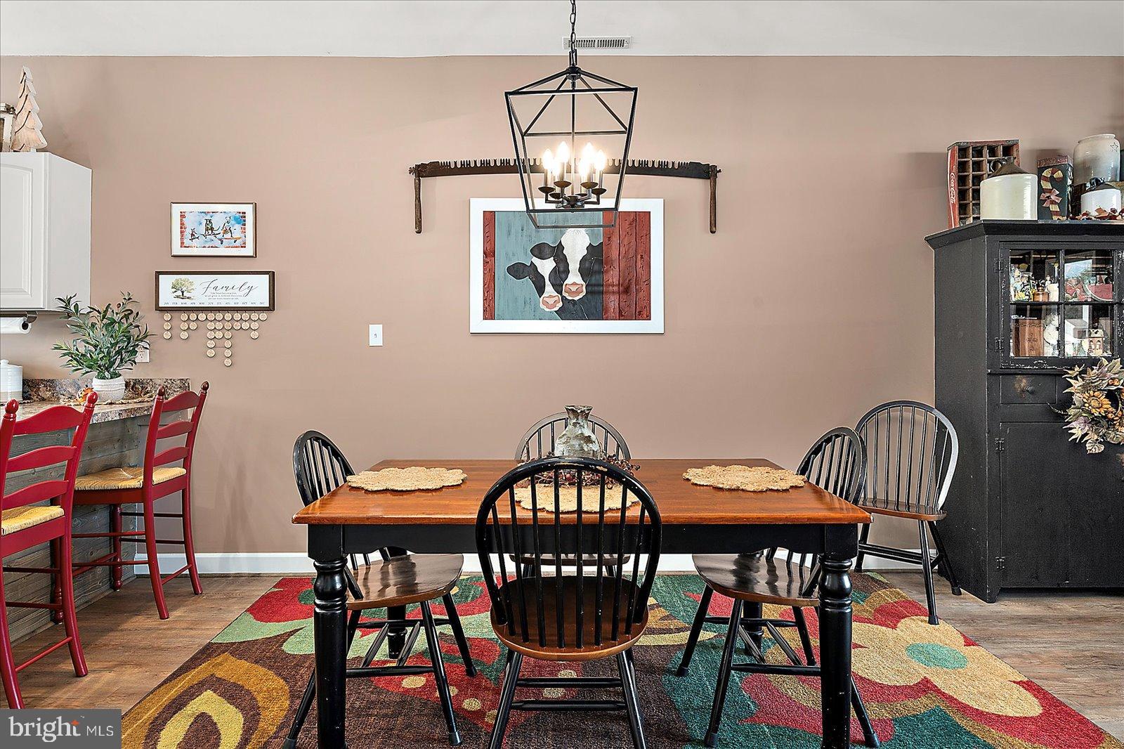 10050 Golf Course Road, Unit 6 Ocean City, MD 21842 - Photo 16 of 60 Charming dining area with rustic decor.