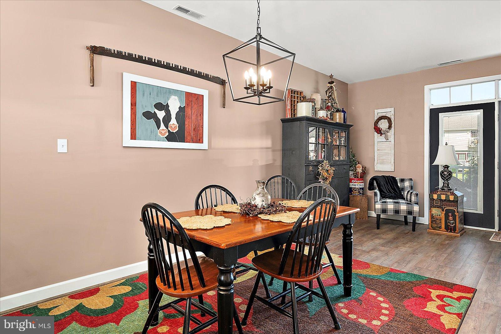 10050 Golf Course Road, Unit 6 Ocean City, MD 21842 - Photo 17 of 60 Charming dining area with artistic flair.