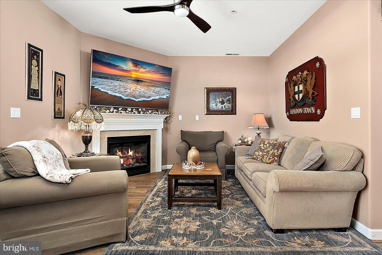 10050 Golf Course Road, Unit 6 Ocean City, MD 21842 - Photo 20 of 60 Cozy living space with warm hues and art.