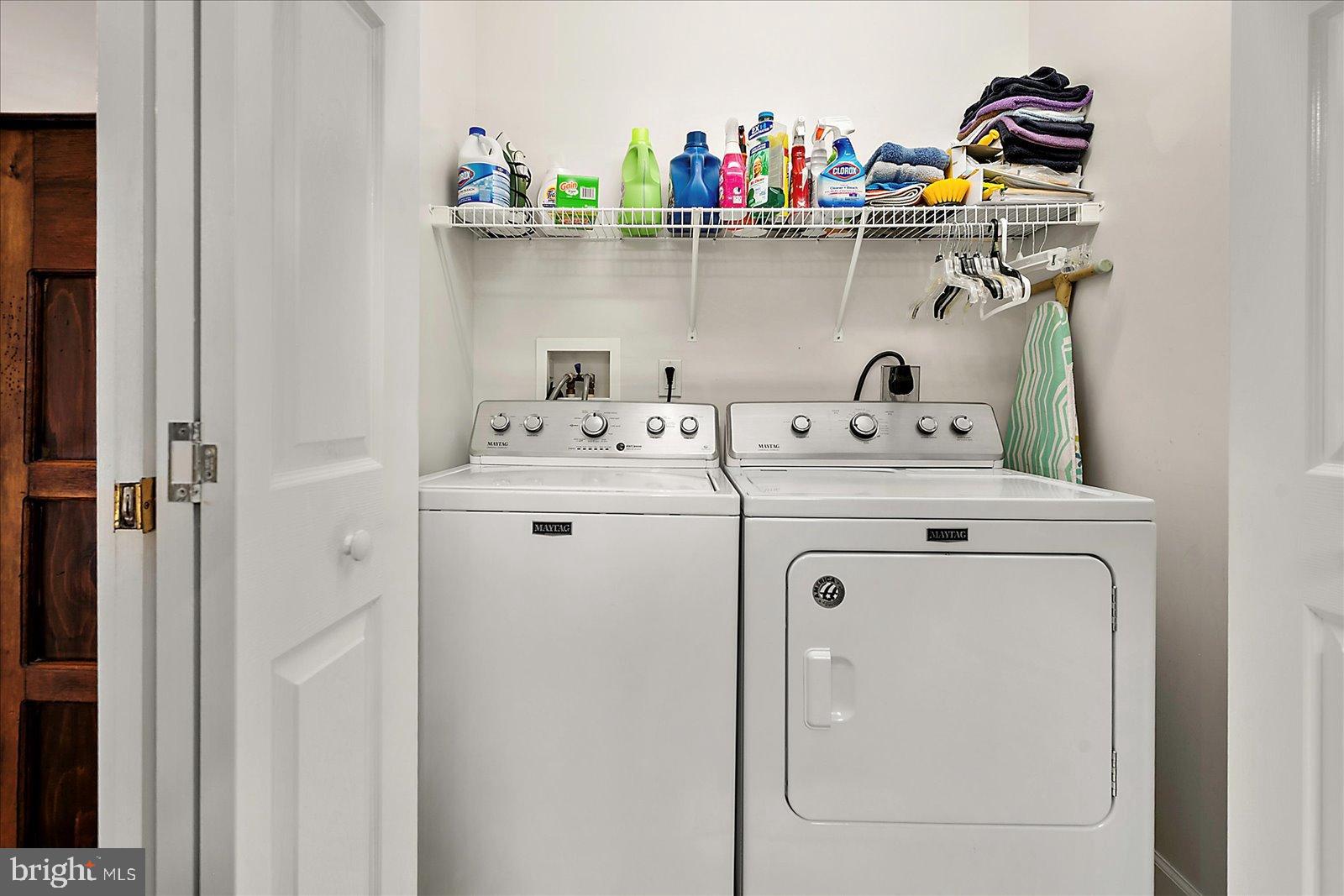 10050 Golf Course Road, Unit 6 Ocean City, MD 21842 - Photo 38 of 60 Efficient laundry space with organized storage.