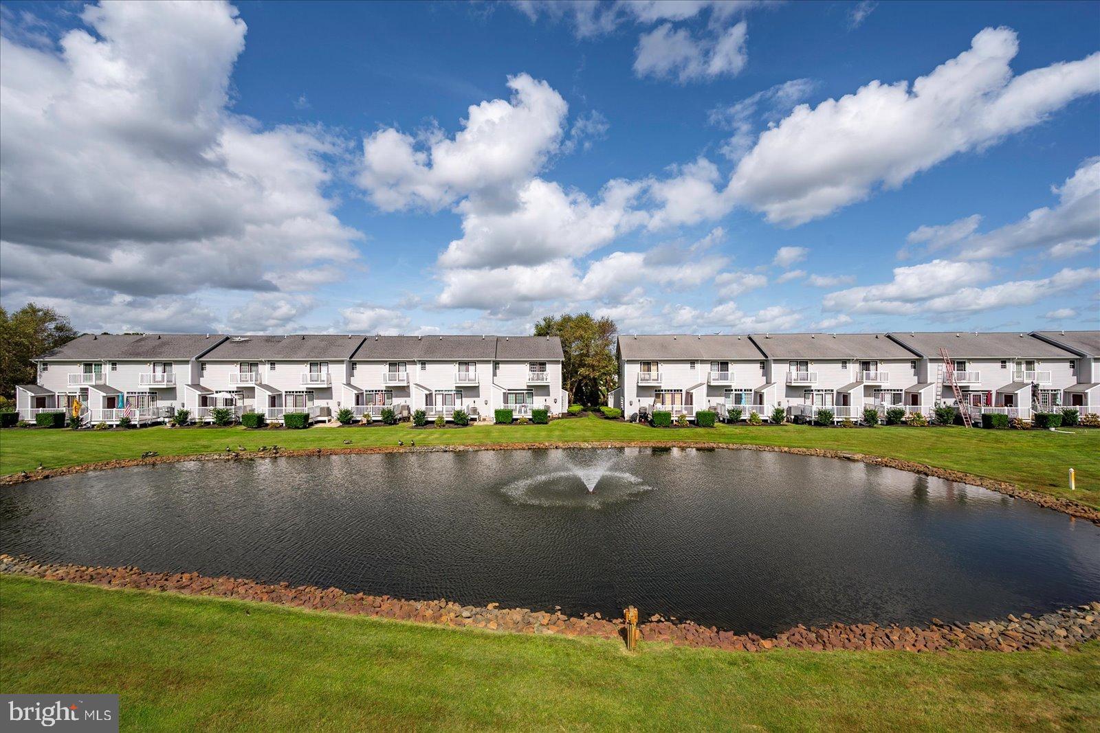 10050 Golf Course Road, Unit 6 Ocean City, MD 21842 - Photo 41 of 60 Tranquil homes by a serene pond.