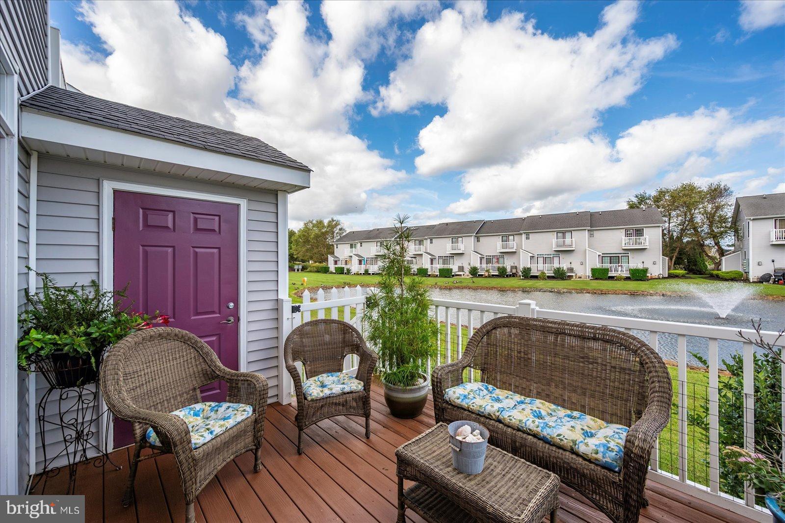10050 Golf Course Road, Unit 6 Ocean City, MD 21842 - Photo 46 of 60 Charming deck overlooking serene waterscape.