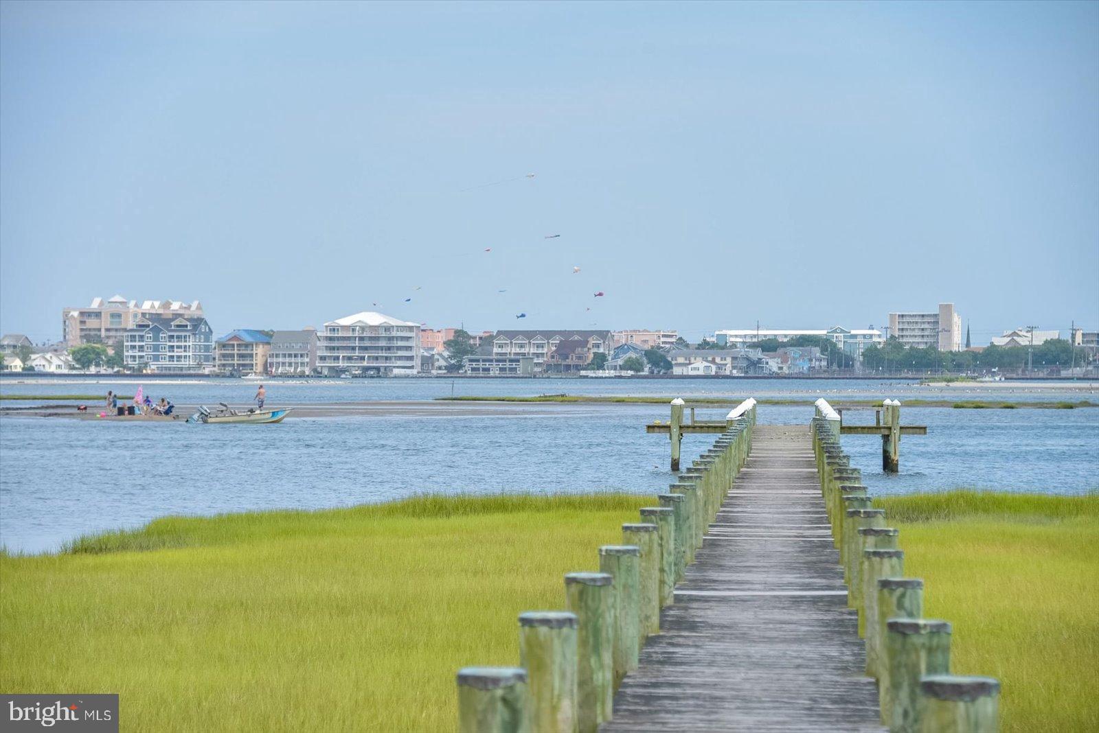 10050 Golf Course Road, Unit 6 Ocean City, MD 21842 - Photo 54 of 60 Tranquil pier leading to coastal views.
