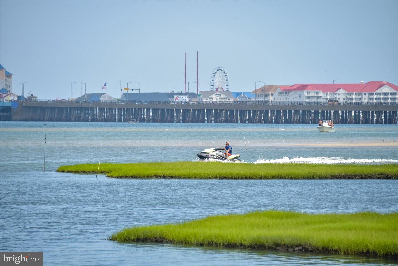 10050 Golf Course Road, Unit 6 Ocean City, MD 21842 - Photo 56 of 60 Jet ski adventure by the vibrant shoreline.