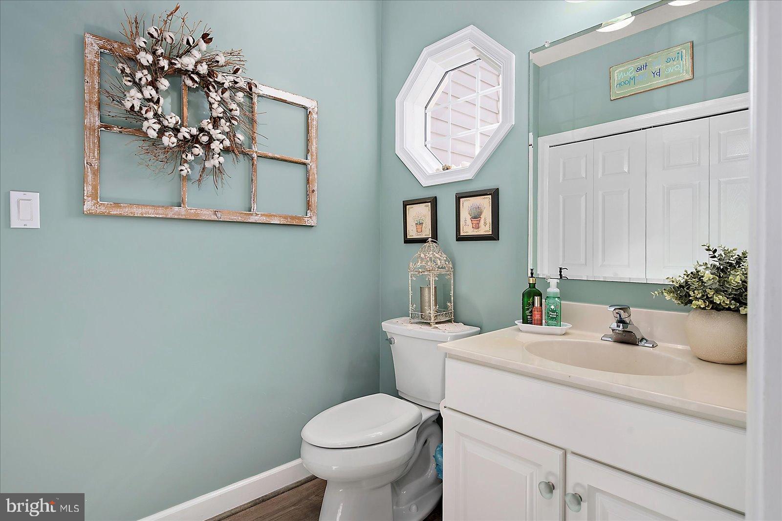 10050 Golf Course Road, Unit 6 Ocean City, MD 21842 - Photo 7 of 60 Charming bathroom with serene blue hues.