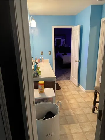 a en suite bathroom with a sink and mirror