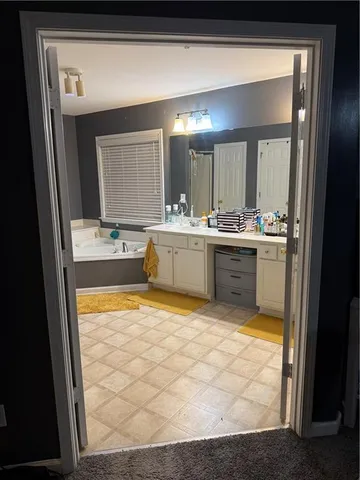 a kitchen with stainless steel appliances granite countertop a sink and cabinets