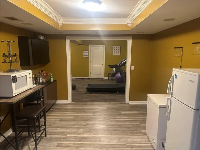 a living room with furniture and a table