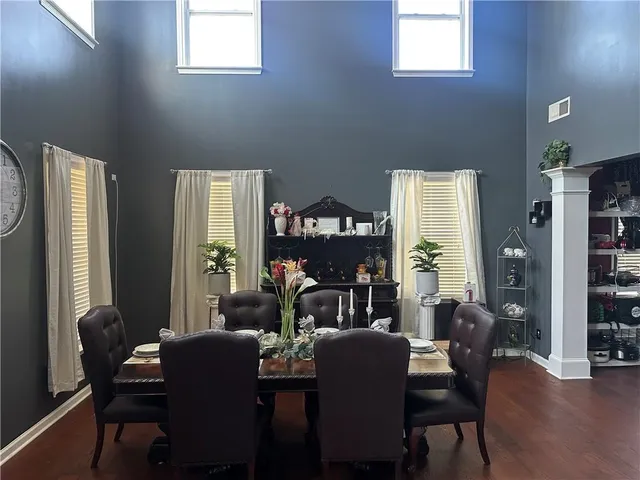 a view of a dining room with furniture and window