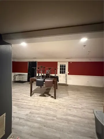 a living room with furniture a ceiling fan and a rug