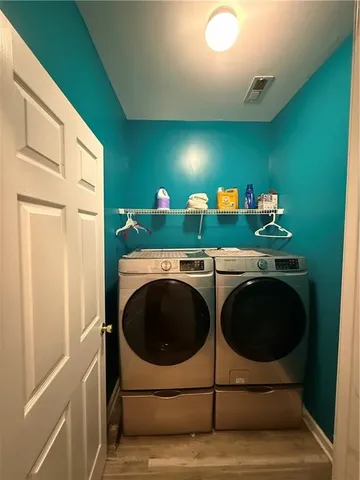 a kitchen with a washer and dryer