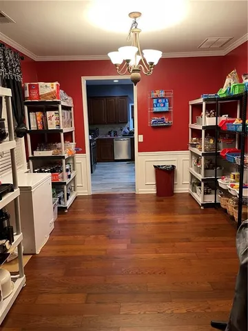 a view of a livingroom with furniture and a flat screen tv