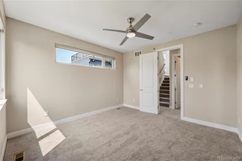 a bathroom with a double vanity sink toilet mirror and shower
