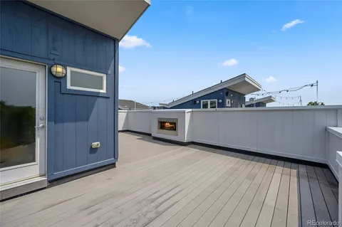 a view of a terrace with wooden walls