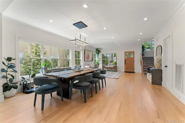 a view of a dining room with furniture window and wooden floor