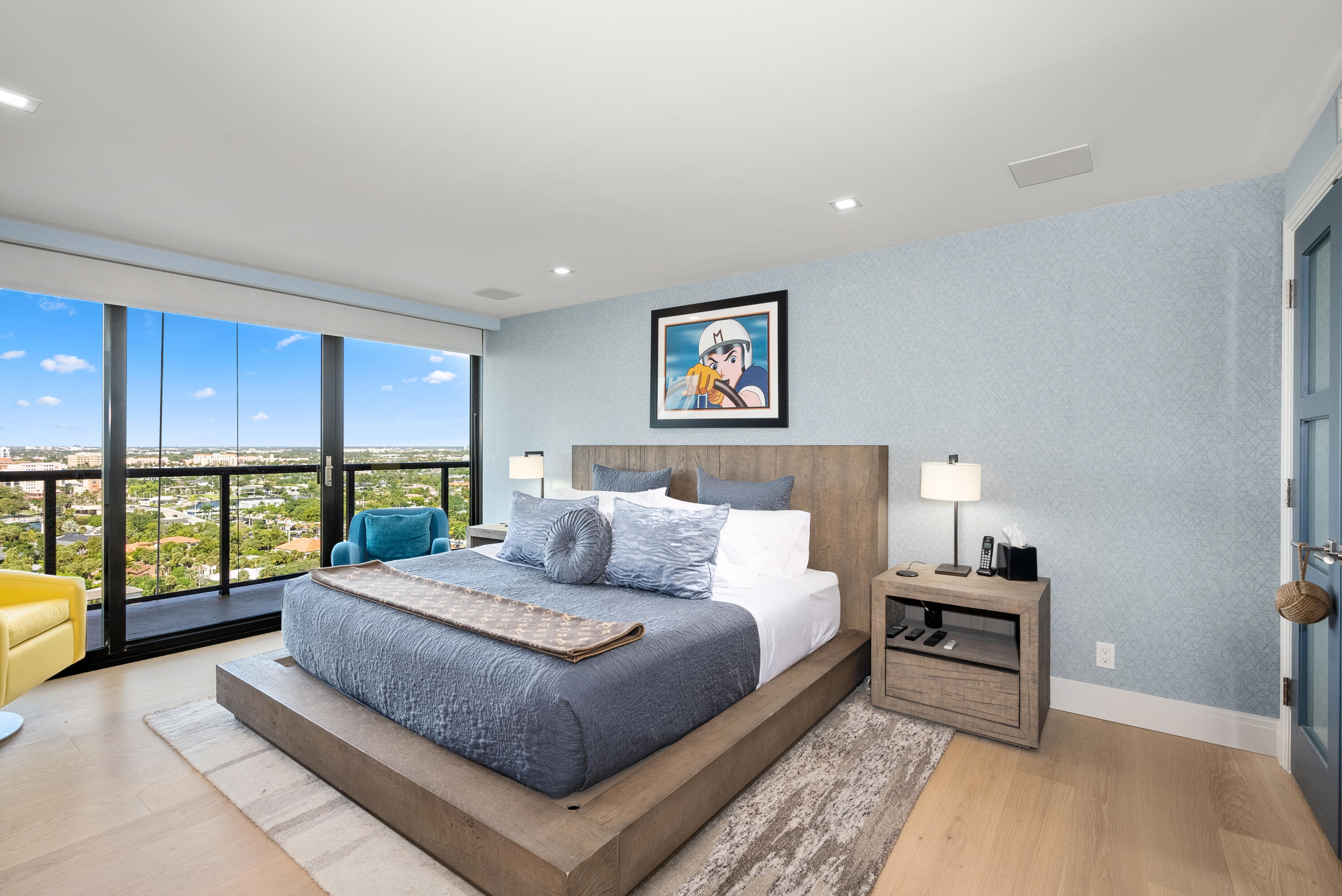 250 South Ocean Boulevard, Unit PH F Boca Raton, FL 33432 - Photo 13 of 30 a spacious bedroom with a bed and a large window