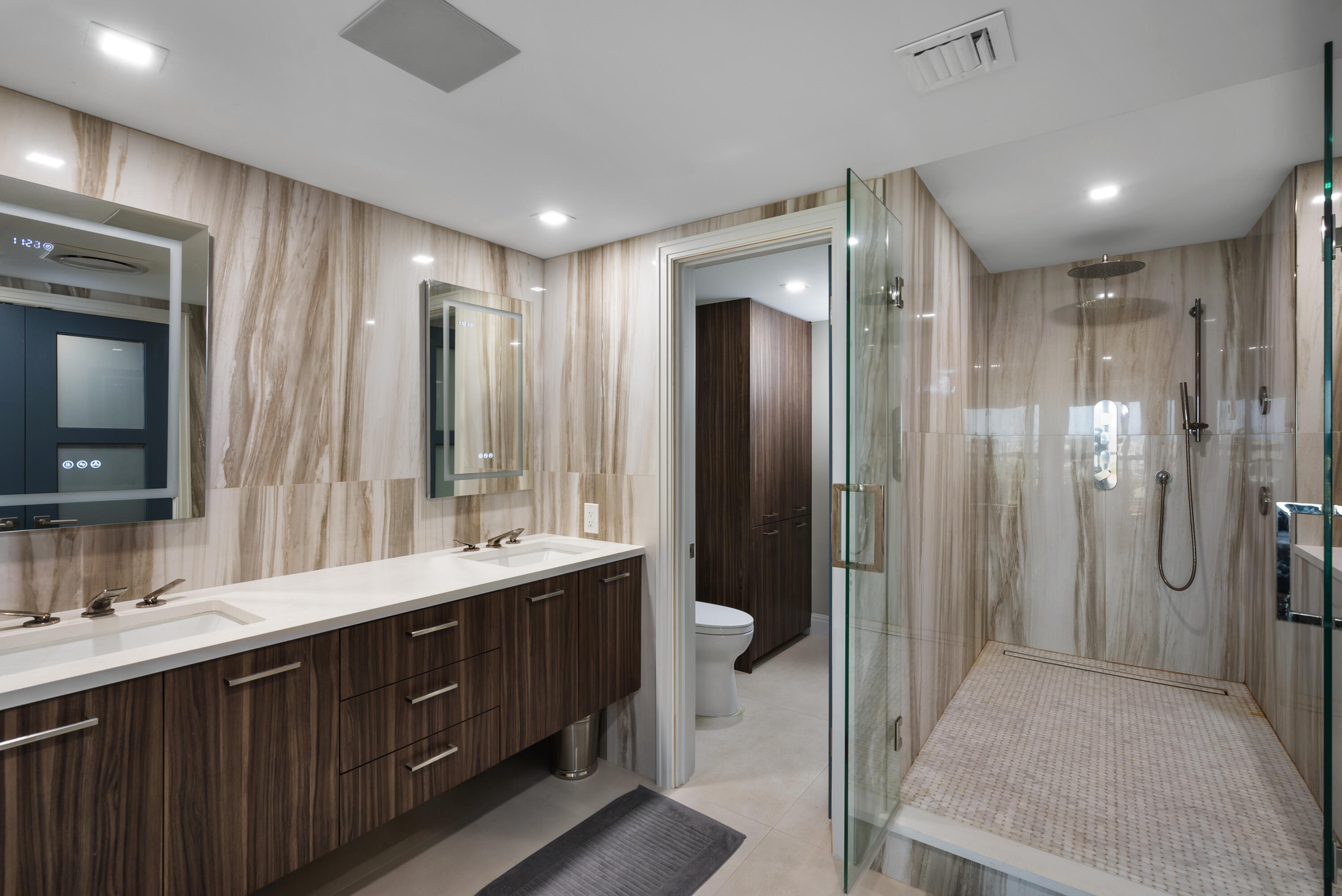 250 South Ocean Boulevard, Unit PH F Boca Raton, FL 33432 - Photo 16 of 30 a bathroom with a double vanity sink mirror and double