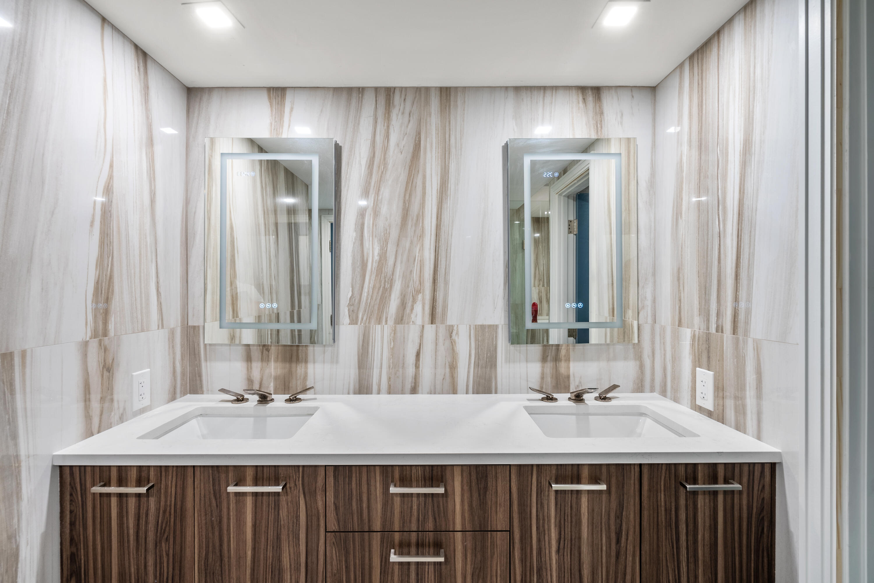 250 South Ocean Boulevard, Unit PH F Boca Raton, FL 33432 - Photo 17 of 30 a bathroom with a granite countertop sink and a mirror