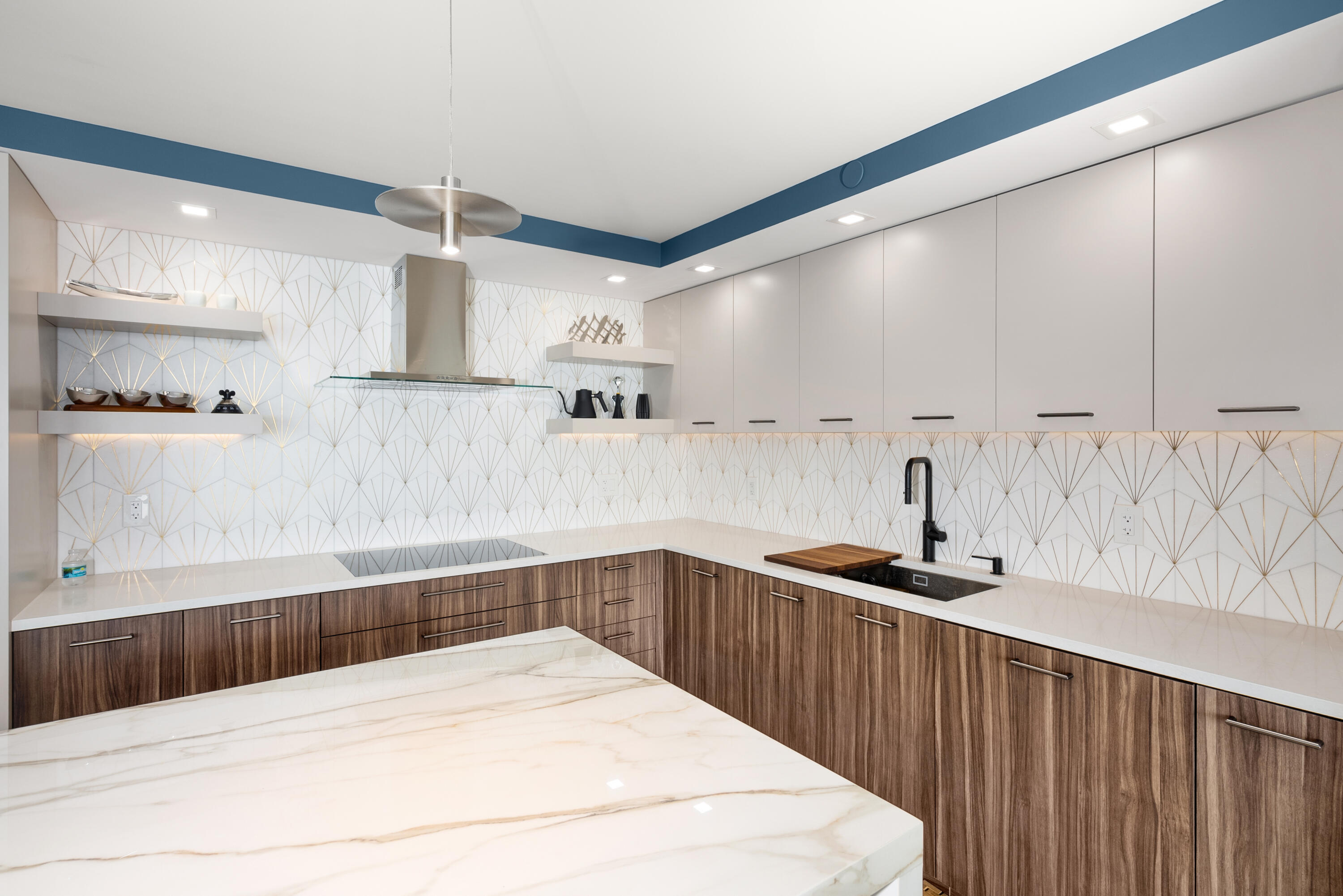 250 South Ocean Boulevard, Unit PH F Boca Raton, FL 33432 - Photo 4 of 30 a kitchen with stainless steel appliances kitchen island granite countertop a sink and cabinets