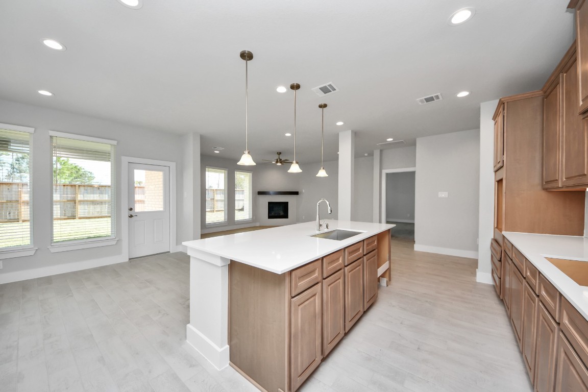 3114 North Spring Drive Spring, TX 77373 - Photo 15 of 45 a large kitchen with kitchen island a sink a stove a refrigerator and a cabinets