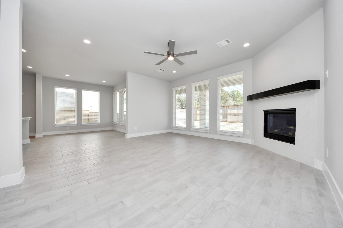 3114 North Spring Drive Spring, TX 77373 - Photo 17 of 45 an empty room with windows and fireplace