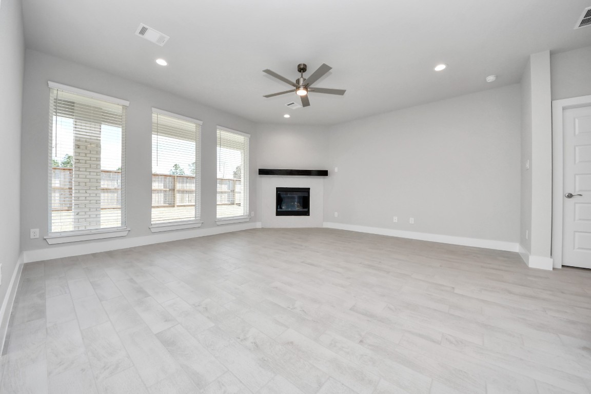 3114 North Spring Drive Spring, TX 77373 - Photo 20 of 45 an empty room with windows and ceiling fan