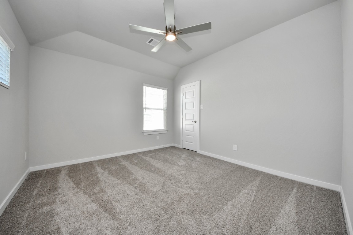 3114 North Spring Drive Spring, TX 77373 - Photo 38 of 45 an empty room with windows and fan